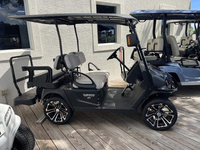 Rear seating and cargo area of 2024 Cushman Shuttle 2+2 Gas at Highland Park Golf Club.