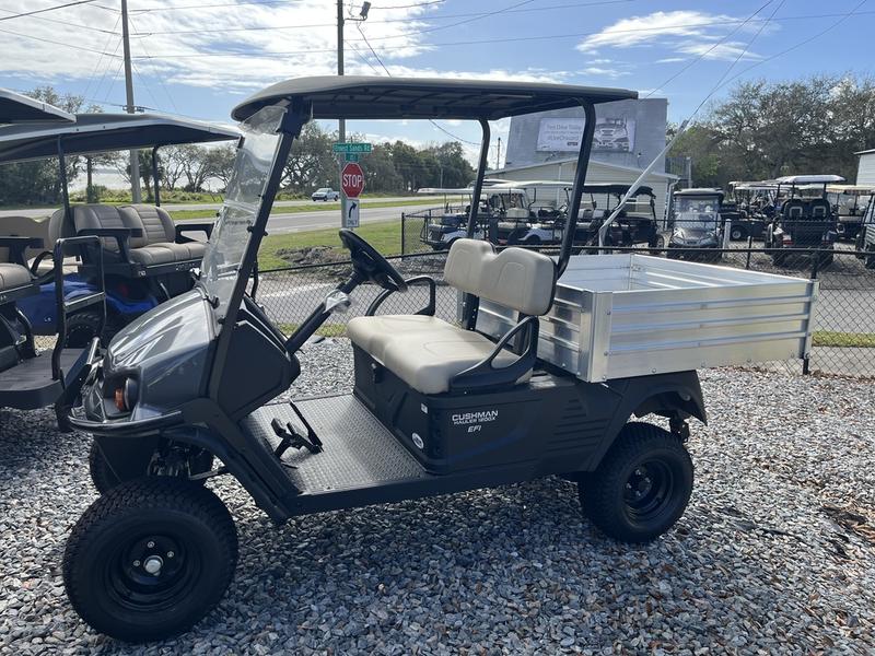 Side profile of the 2025 Cushman Hauler 1200X Gas utility cart in Naples, Florida.