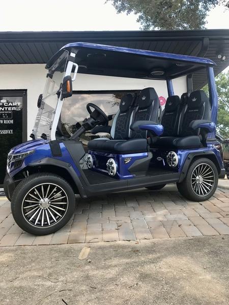 Front view of 2025 Evolution D-Max GT4 Blue electric golf cart available in Florida with export and nationwide delivery options