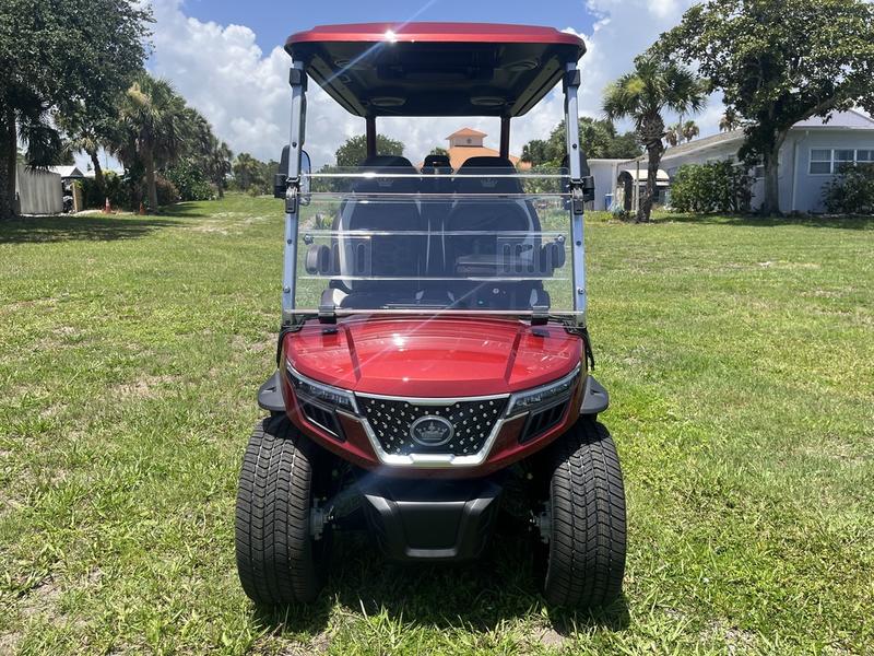 Side profile of 2025 Evolution D-Max GT4 Red golf cart available in Virginia with export and nationwide delivery
