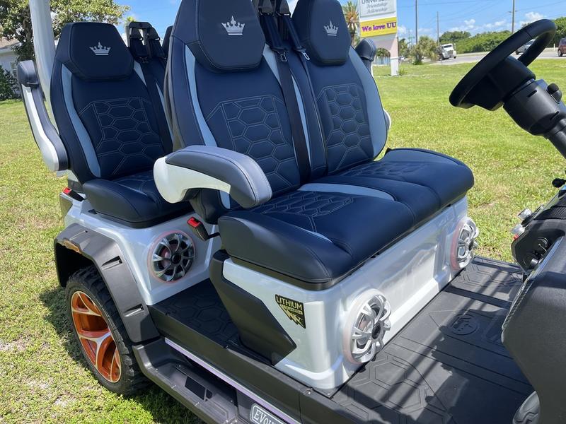 Front angle of 2025 Evolution D5-Maverick 6 Plus Texas White six-seater golf cart