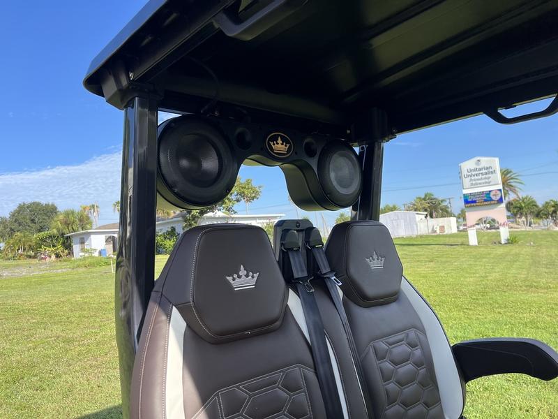 Interior seating of 2025 Evolution D-Max XT6 black, six-passenger golf cart available in Pennsylvania