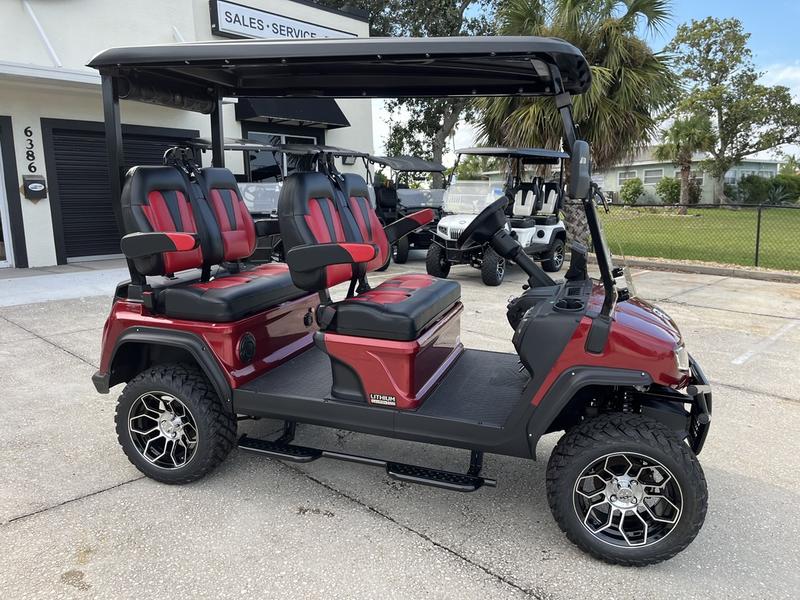 Front angle of 2025 Evolution D5-Maverick 4 red electric golf cart