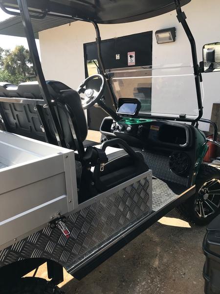 Rear view of 2025 Evolution Turfman 800 green utility vehicle available in Illinois