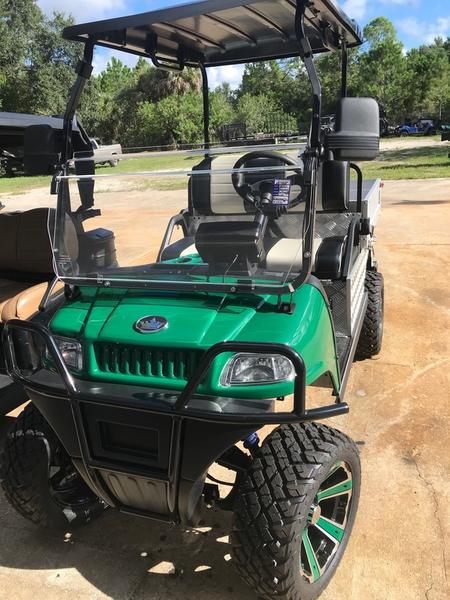 Side profile of 2025 Evolution Turfman 800 green utility vehicle available in Illinois with nationwide delivery and export