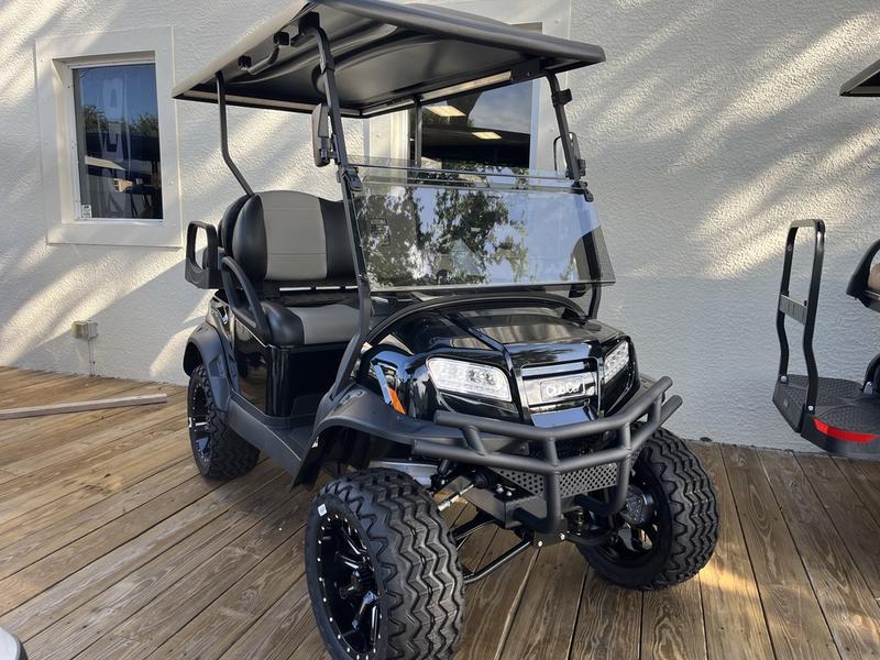 Side view of 2025 Club Car Onward Lifted 4 Passenger Gas golf cart in Dallas Texas