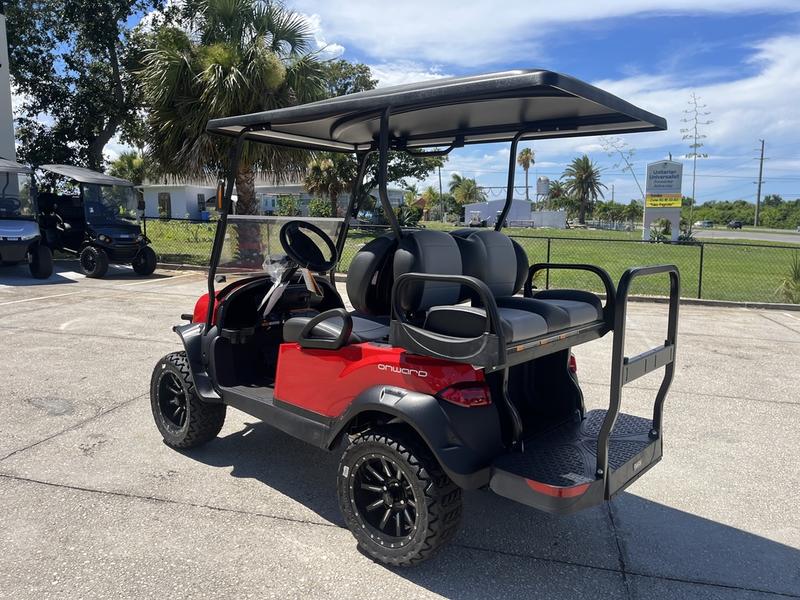 Front view of red 2025 Evolution D-Max XT4 electric golf cart available in Texas with nationwide delivery and export options