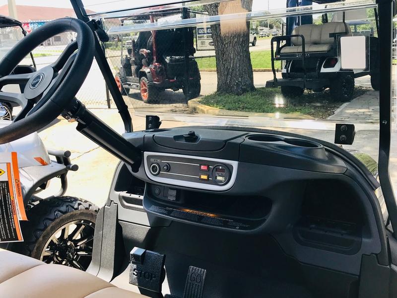Dashboard and steering controls on 2026 Club Car Onward Lifted 4 Passenger Gas black available in North Carolina