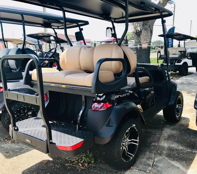 Front view of black 2026 Club Car Onward Lifted 4 Passenger Gas with LED headlights available in Texas and nationwide