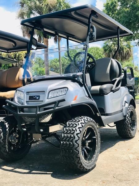 Side view of 2026 Club Car Onward Lifted 4 Passenger Gas golf cart in metallic finish