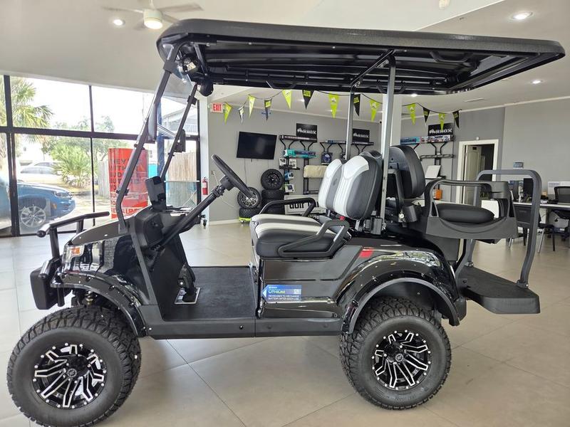 Suspension and all-terrain tires of 2026 Star EV CP-2+2 Lifted in Savannah, Georgia.