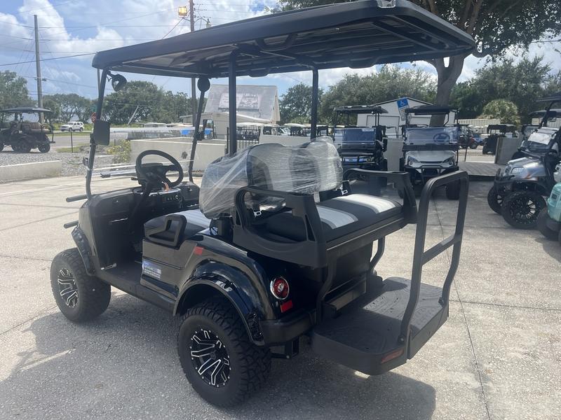 Lifted suspension and all-terrain tires of 2026 Star EV Capella 2+2 Lifted in Palm Beach.