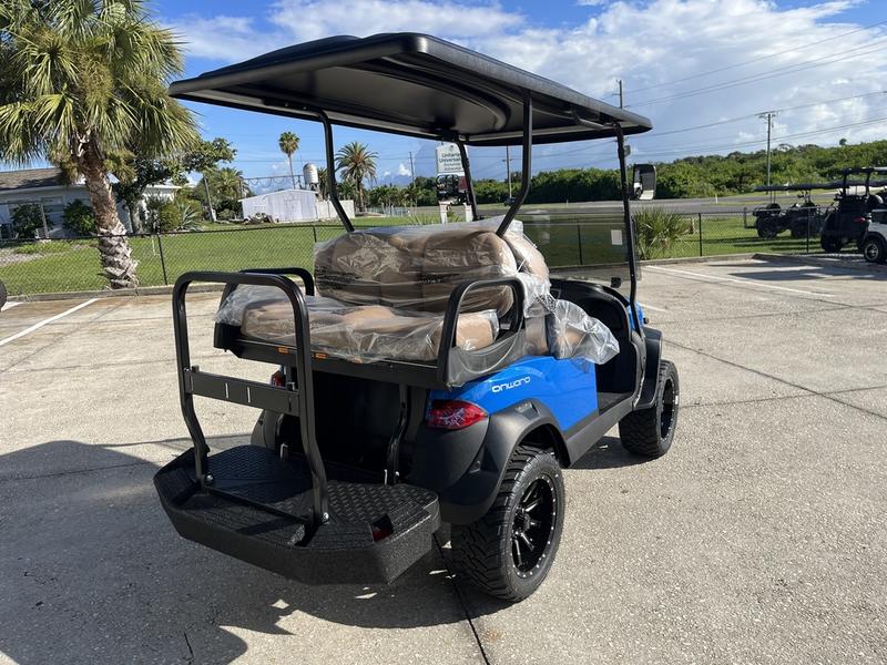 Side view of 2026 Club Car Onward Lifted 4 Passenger Gas blue golf cart in North Carolina