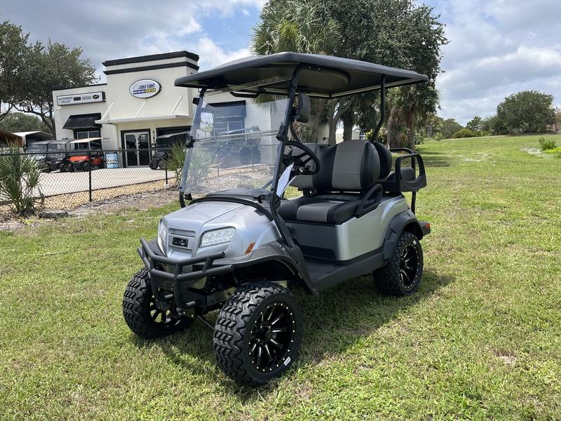 Side view of 2026 Club Car Onward Lifted 4 Passenger Gas golf cart in Florida
