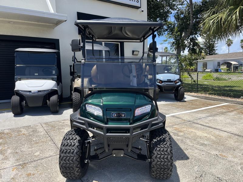 Side view of 2026 Club Car Onward Lifted 4 Passenger Gas green golf cart in Arizona