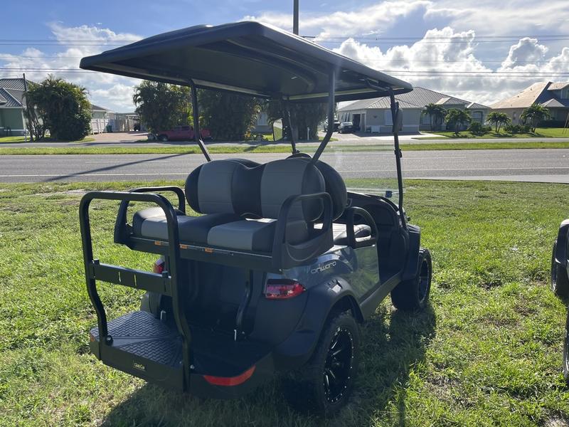 Text: Rear fold-down seat and cargo platform on 2026 Club Car Onward Lifted Gas grey South Carolina