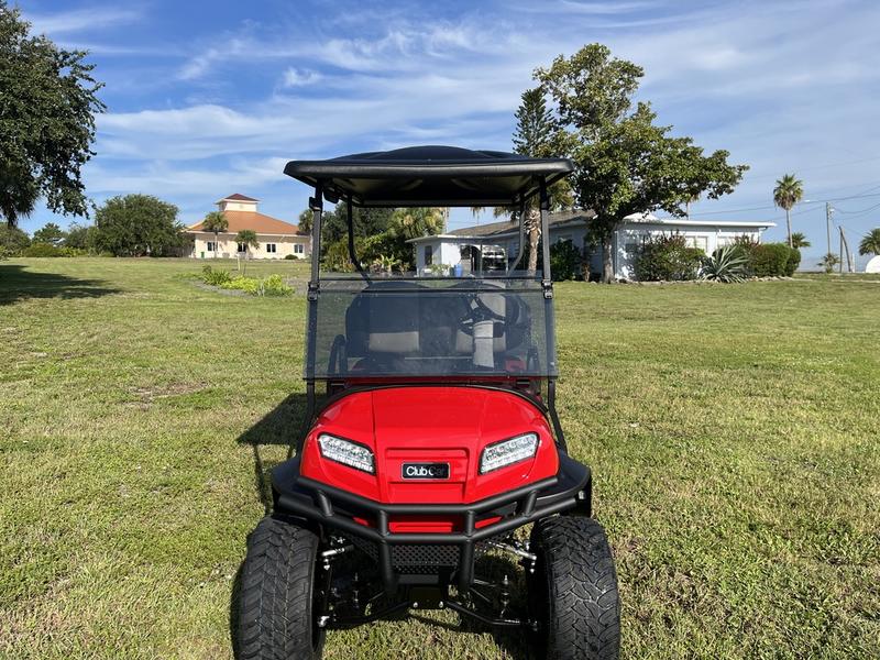 Lifted suspension and off-road tires on 2026 Club Car Onward Lifted 4 Passenger Gas red California