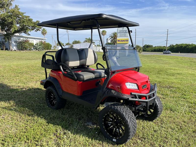 Front view of red 2025 Evolution D-Max XT4 electric golf cart available in Texas with nationwide delivery and export options