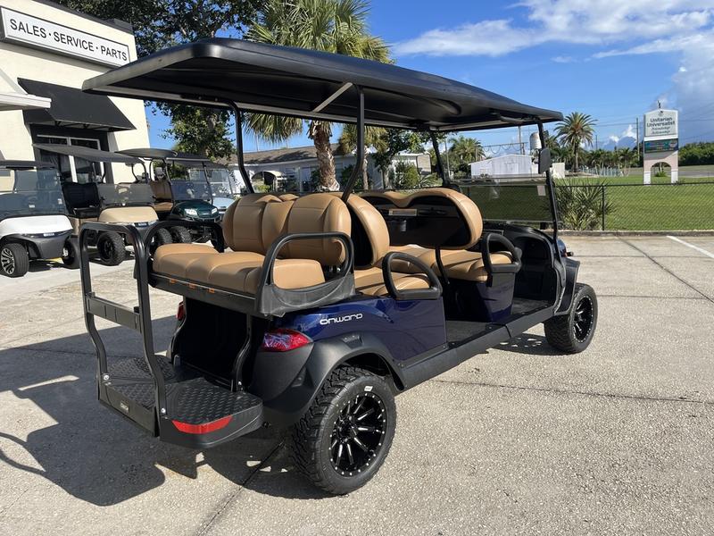 Side view of 2026 Club Car Onward Lifted 6 Passenger Gas blue golf cart in Michigan