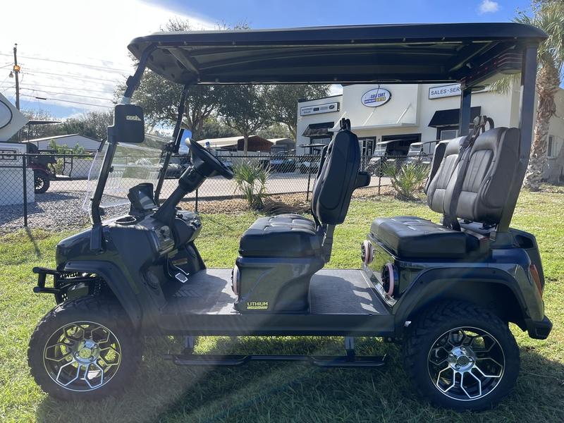 Street-legal 2025 Evolution D5-Maverick 4 Plus black golf cart on road