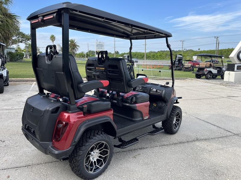 Street-legal 2025 Evolution D5-Maverick 4 red golf cart driving on road