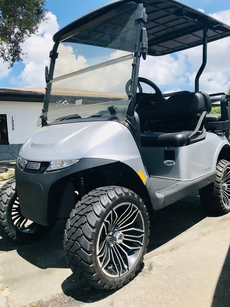 Front angle of 2024 E-Z-GO Valor EX1 Gas Platinum golf cart in Virginia Beach Virginia showing sleek platinum finish and headlights