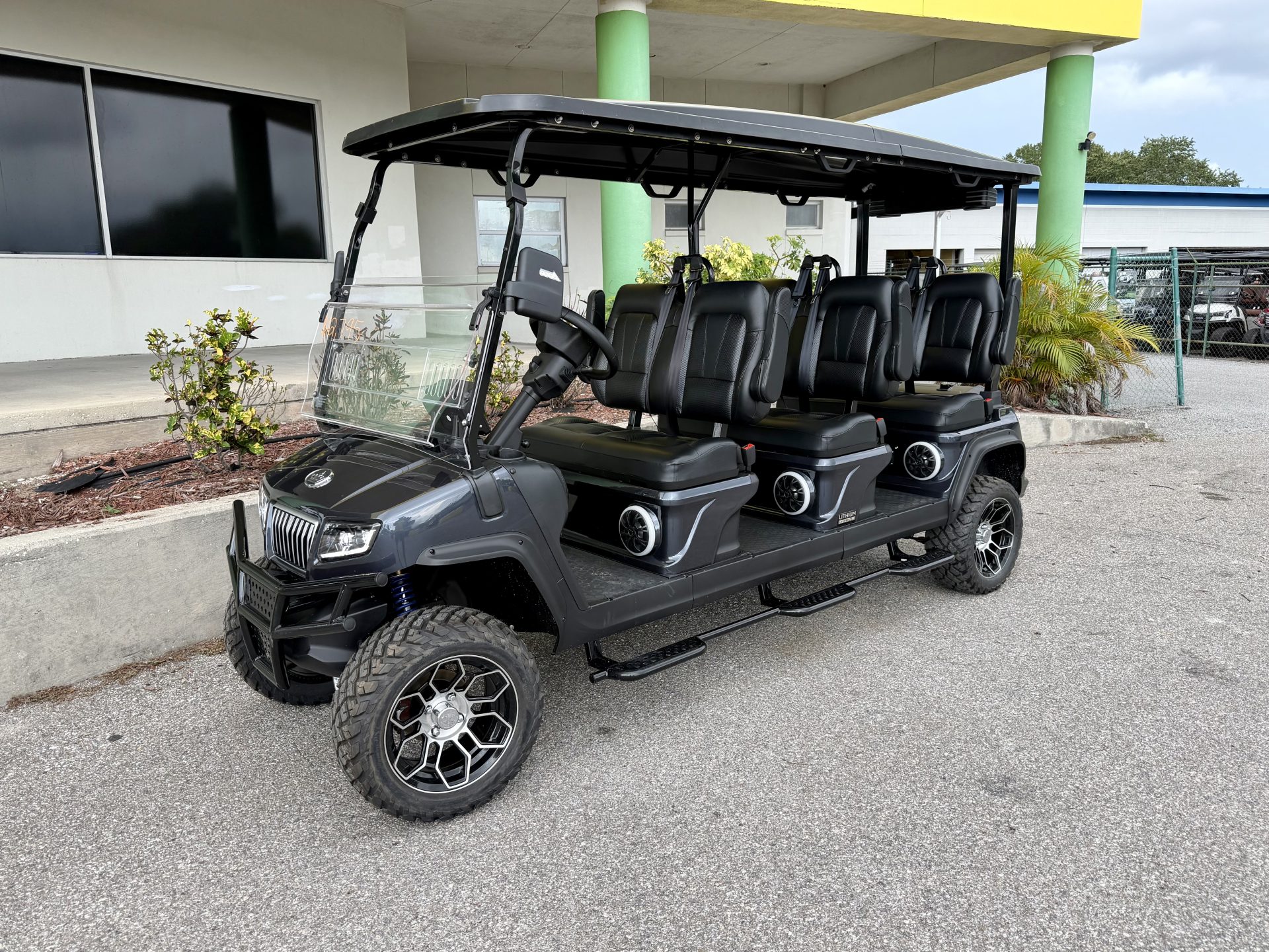 Front three-quarter view of the 2026 Evolution D5 Maverick 6 electric golf cart in Charcoal Gray
