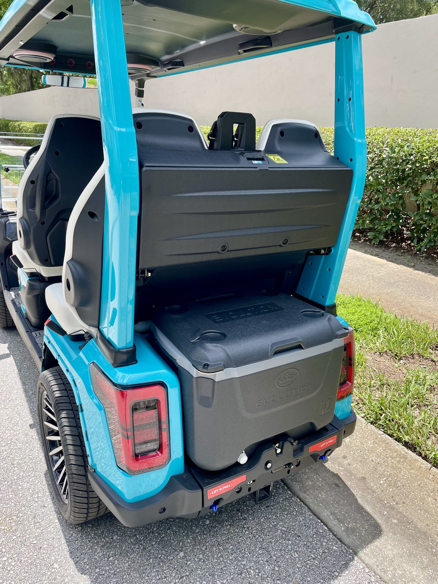 Side view of the 2026 Evolution D-Max GT4 Sky Blue with four forward-facing White seats